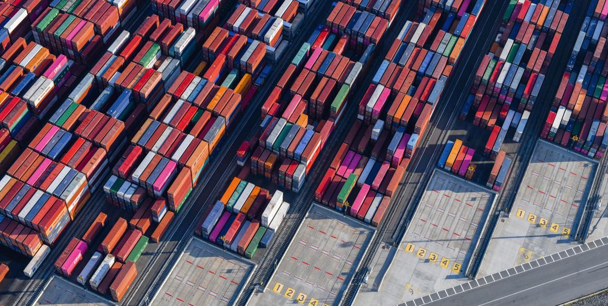 Aerial view of stacked shipping containers at a US container port